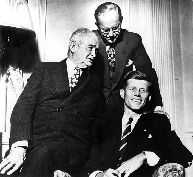 John Francis "Honey Fitz" Fitzgerald (left), with his son-in-law Joe Kennedy Sr. (standing), and his grandson, John Fitzgerald Kennedy (seated)